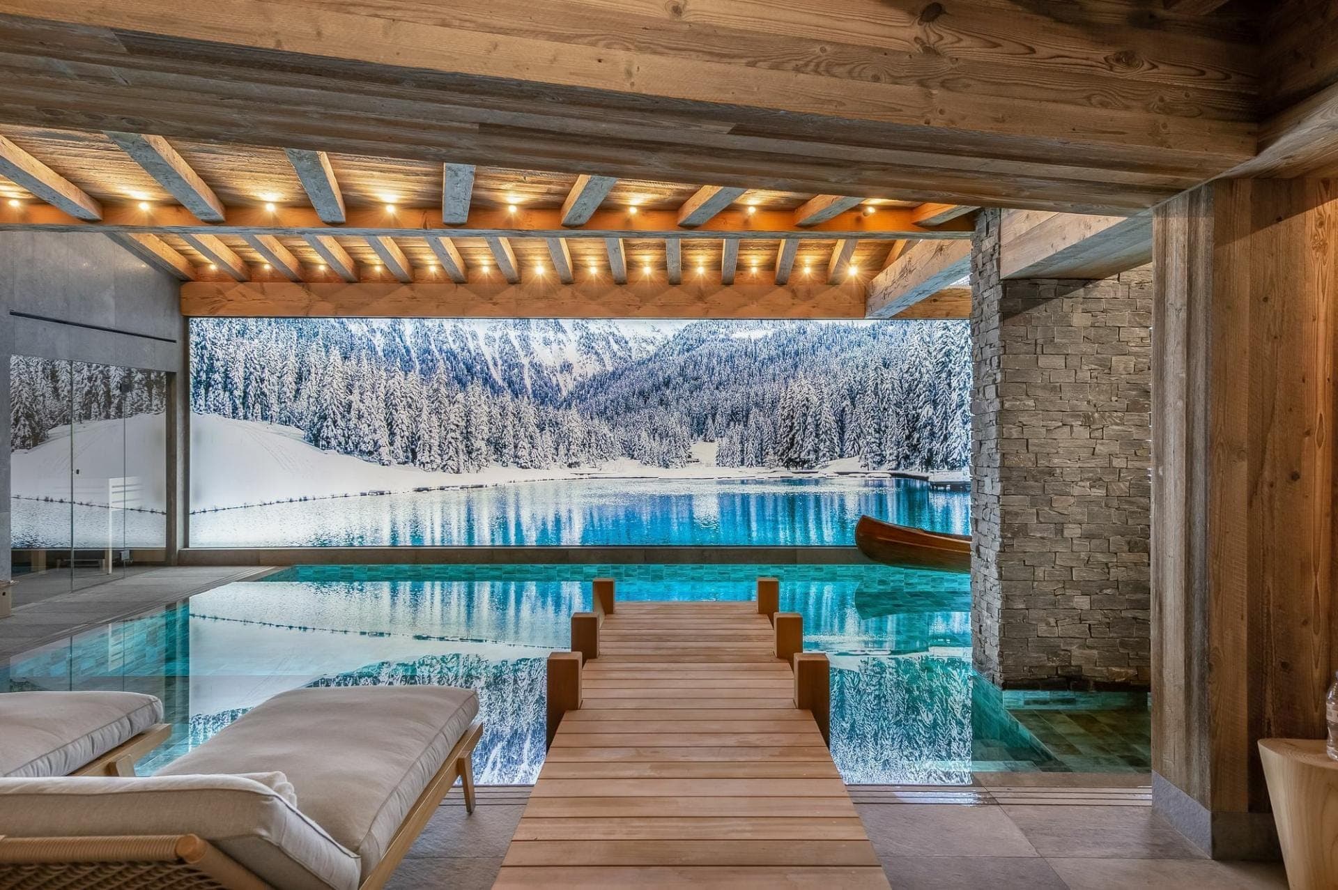 Chalet Nordéa indoor pool with panoramic snow-covered alpine lake view